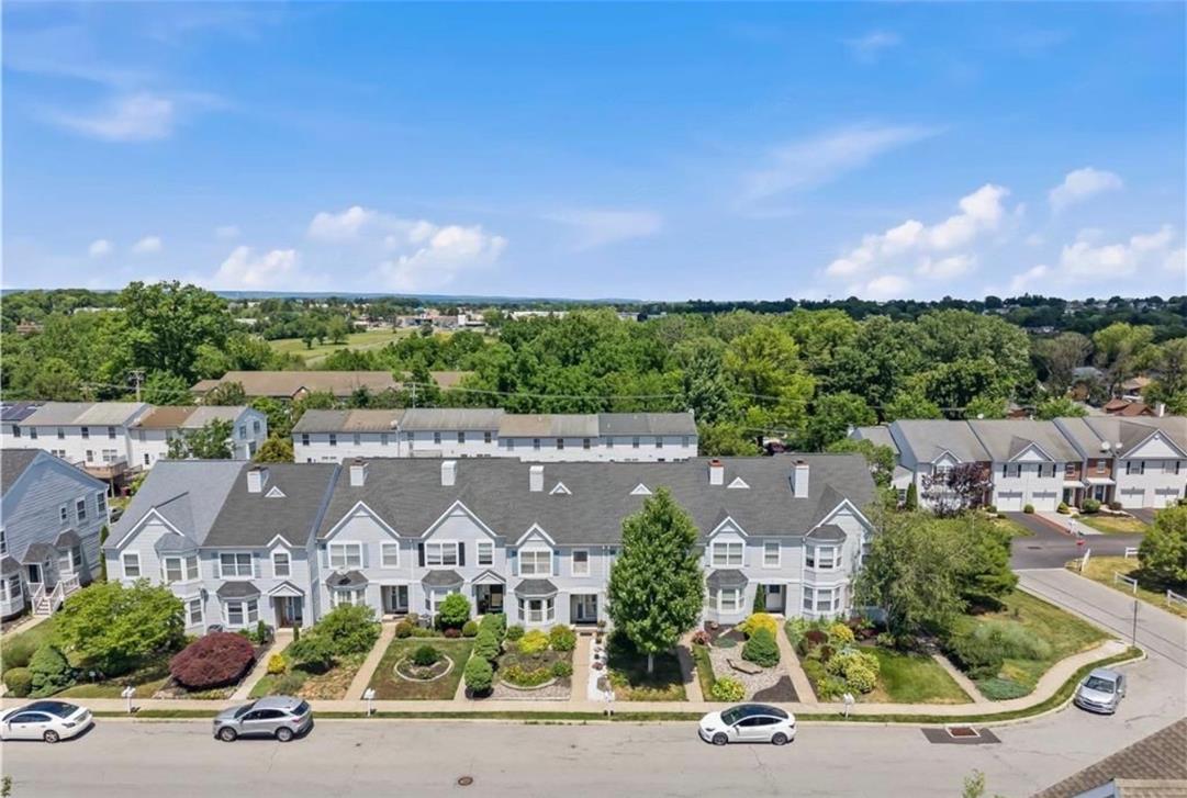 309 Hill Road Whitehall, PA 18052 - Photo 2 of 19 An aerial perspective reveals a harmonious row of contemporary townhomes, each with well-maintained landscaping and inviting front entrances.