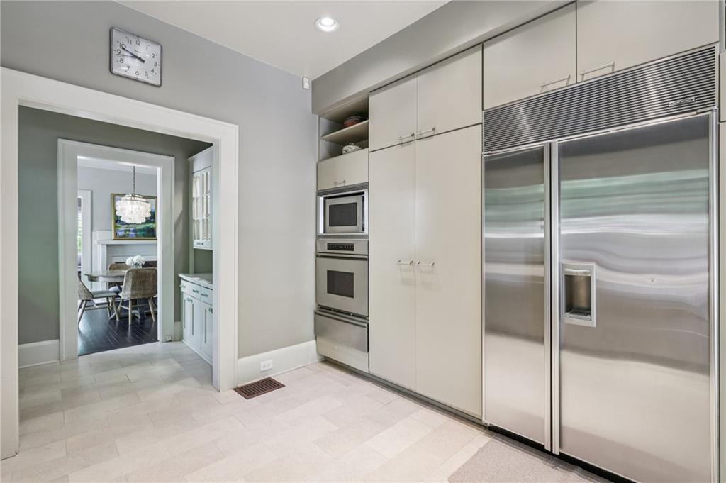 429 Adams Street Decatur, GA 30030 - Photo 23 of 100 a kitchen with stainless steel appliances kitchen island a refrigerator and a sink