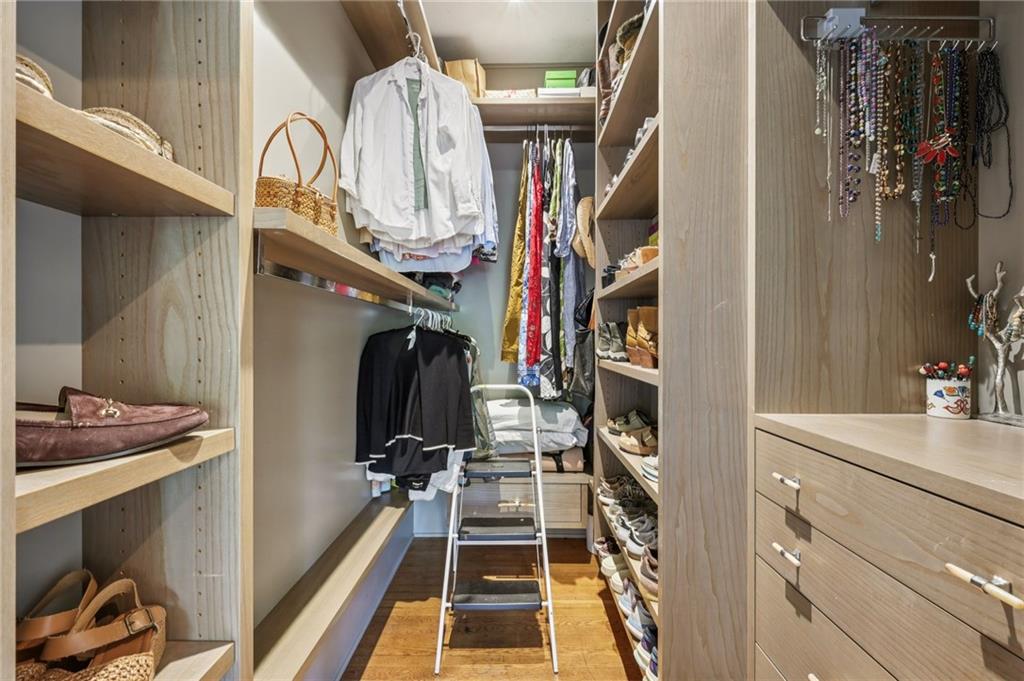 429 Adams Street Decatur, GA 30030 - Photo 27 of 100 a view of walk in closet with clothes and shoes