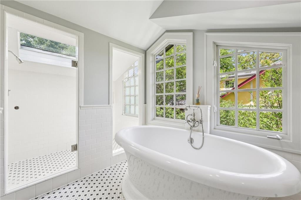 429 Adams Street Decatur, GA 30030 - Photo 37 of 100 a bath tub sitting in a bathroom next to a window