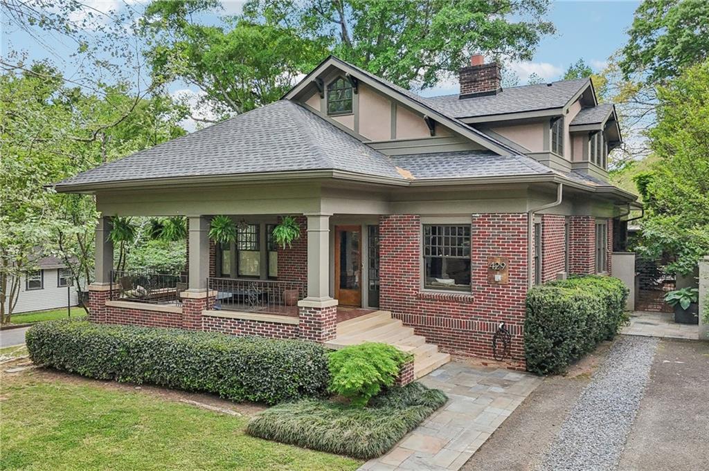 429 Adams Street Decatur, GA 30030 - Photo 54 of 100 a front view of a house with porch and glass windows