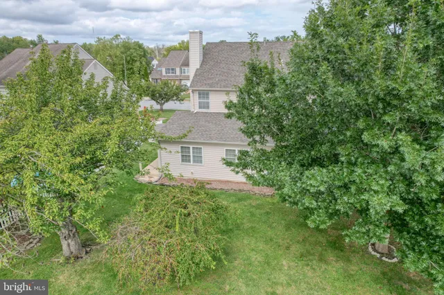 an aerial view of a house with a garden