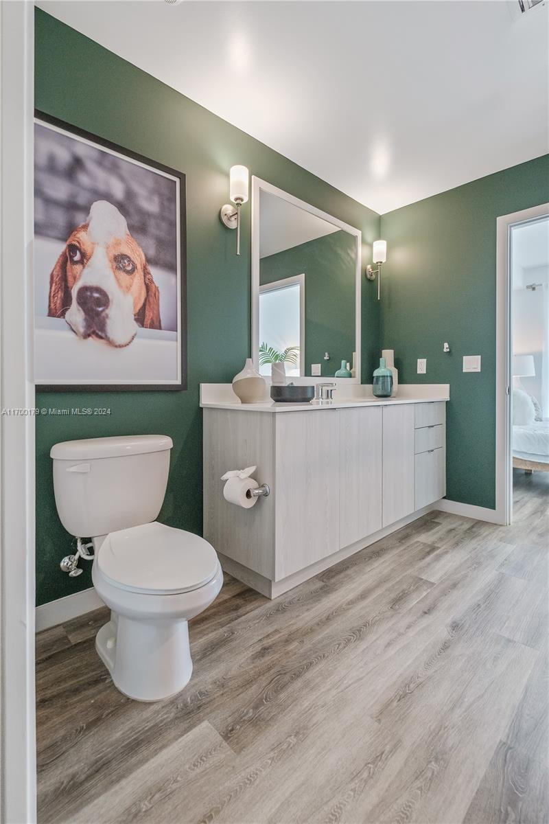 1919 Southeast 10th Avenue, Unit 2130 Fort Lauderdale, FL 33316 - Photo 22 of 35 a view of bathroom with a toilet and a sink