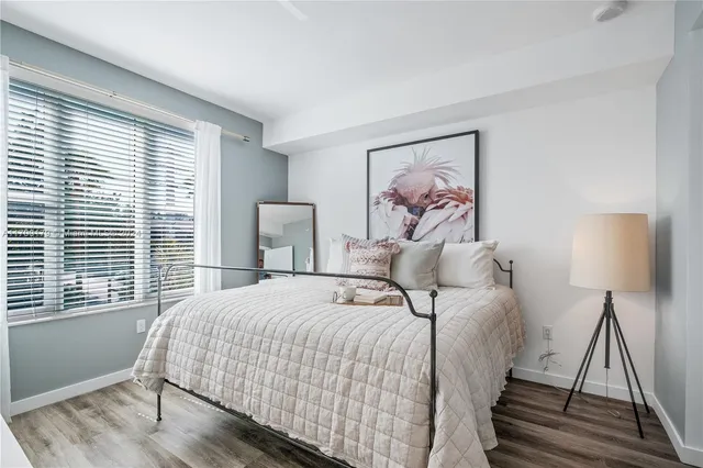 a bedroom with bed and window