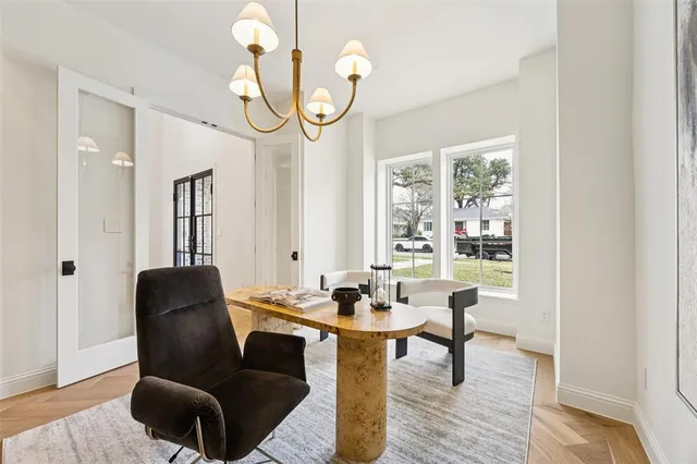 a view of a livingroom with furniture and a window