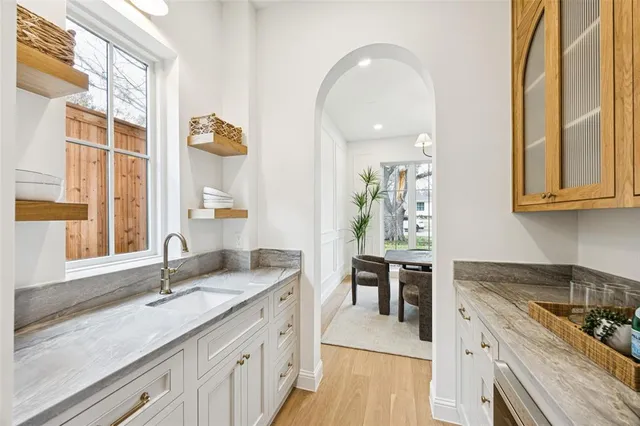 a kitchen with sink and cabinets