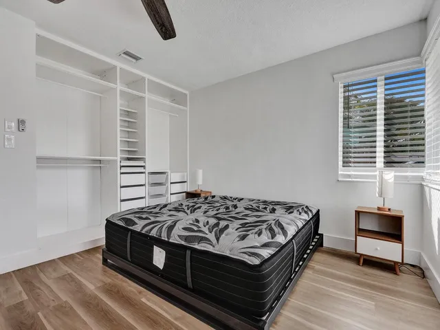 a view of a house with a backyard and a patio