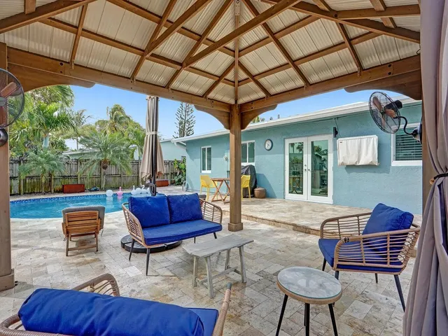a view of a chairs and tables in patio