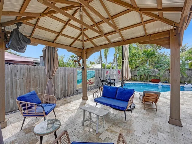 a view of a swimming pool with a patio