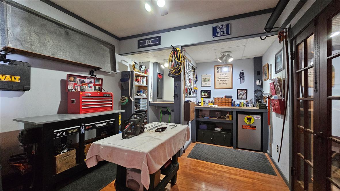 585 Buttermilk Road Hellertown, PA 18055 - Photo 73 of 82 A dedicated workshop area offers ample storage and a robust workbench for hobbies and projects.
