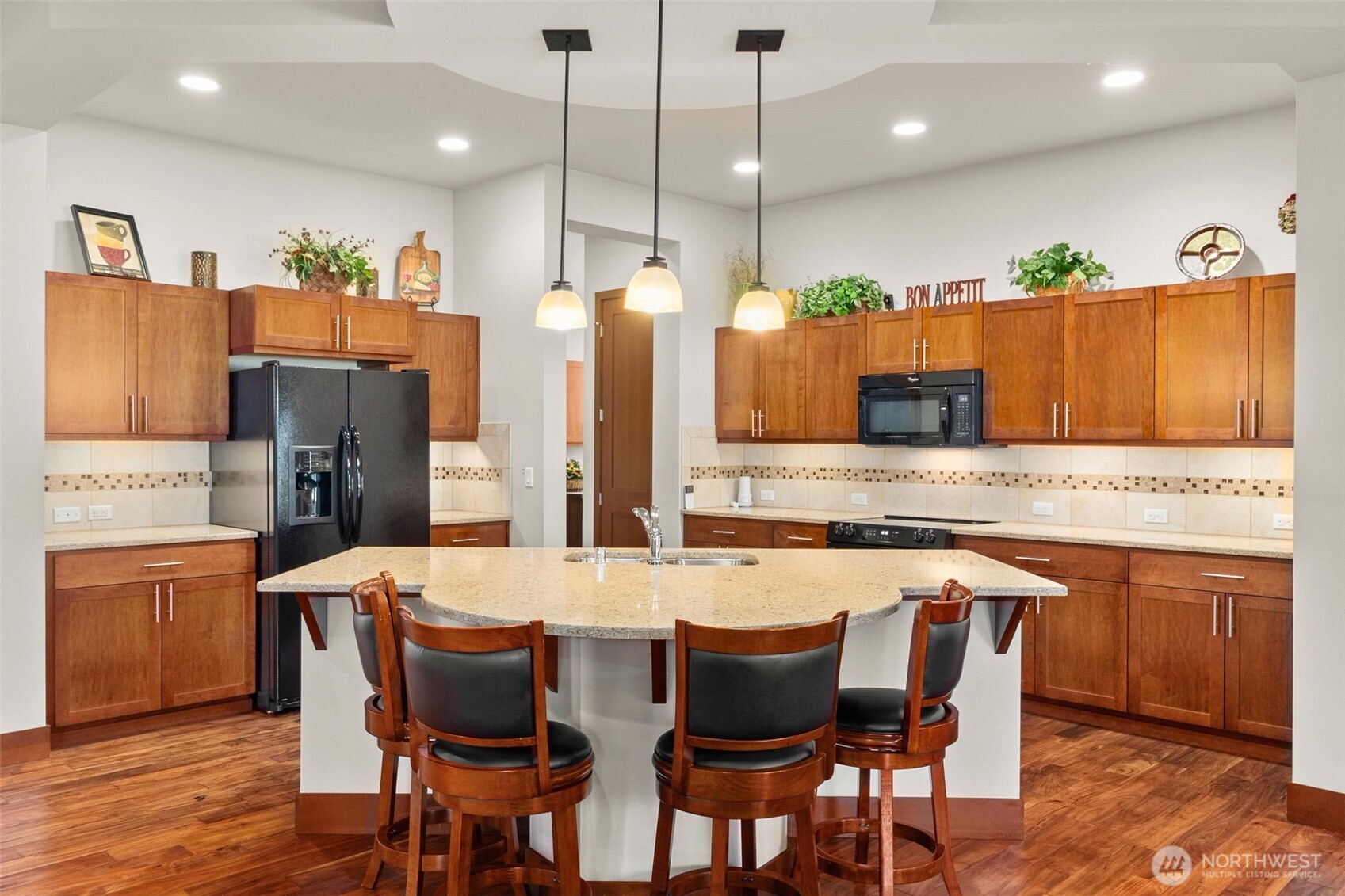 8235 Orcas Loop Northeast Olympia, WA 98516 - Photo 11 of 39 a large kitchen with a table and chairs