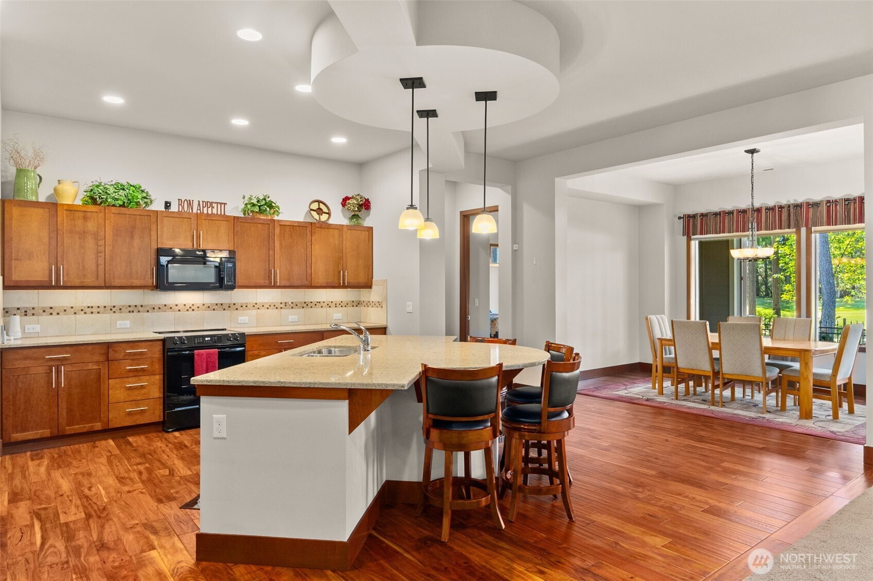 8235 Orcas Loop Northeast Olympia, WA 98516 - Photo 15 of 39 a large kitchen with a table and chairs