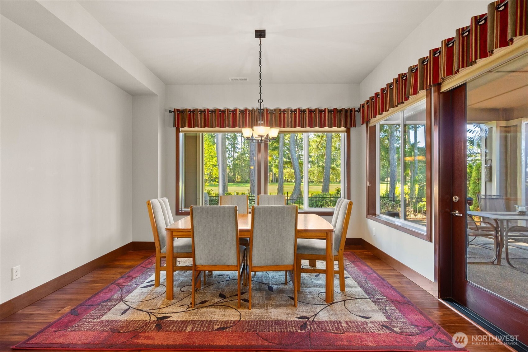 8235 Orcas Loop Northeast Olympia, WA 98516 - Photo 16 of 39 a view of a dining room with furniture window and wooden floor