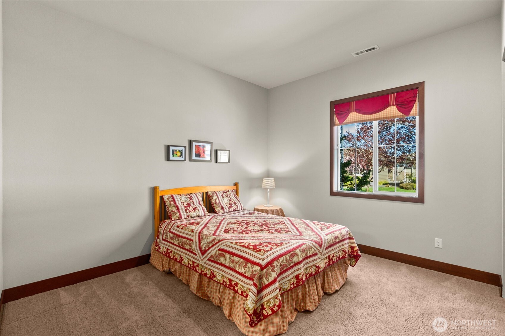 8235 Orcas Loop Northeast Olympia, WA 98516 - Photo 20 of 39 a bedroom with a bed and painting on the wall