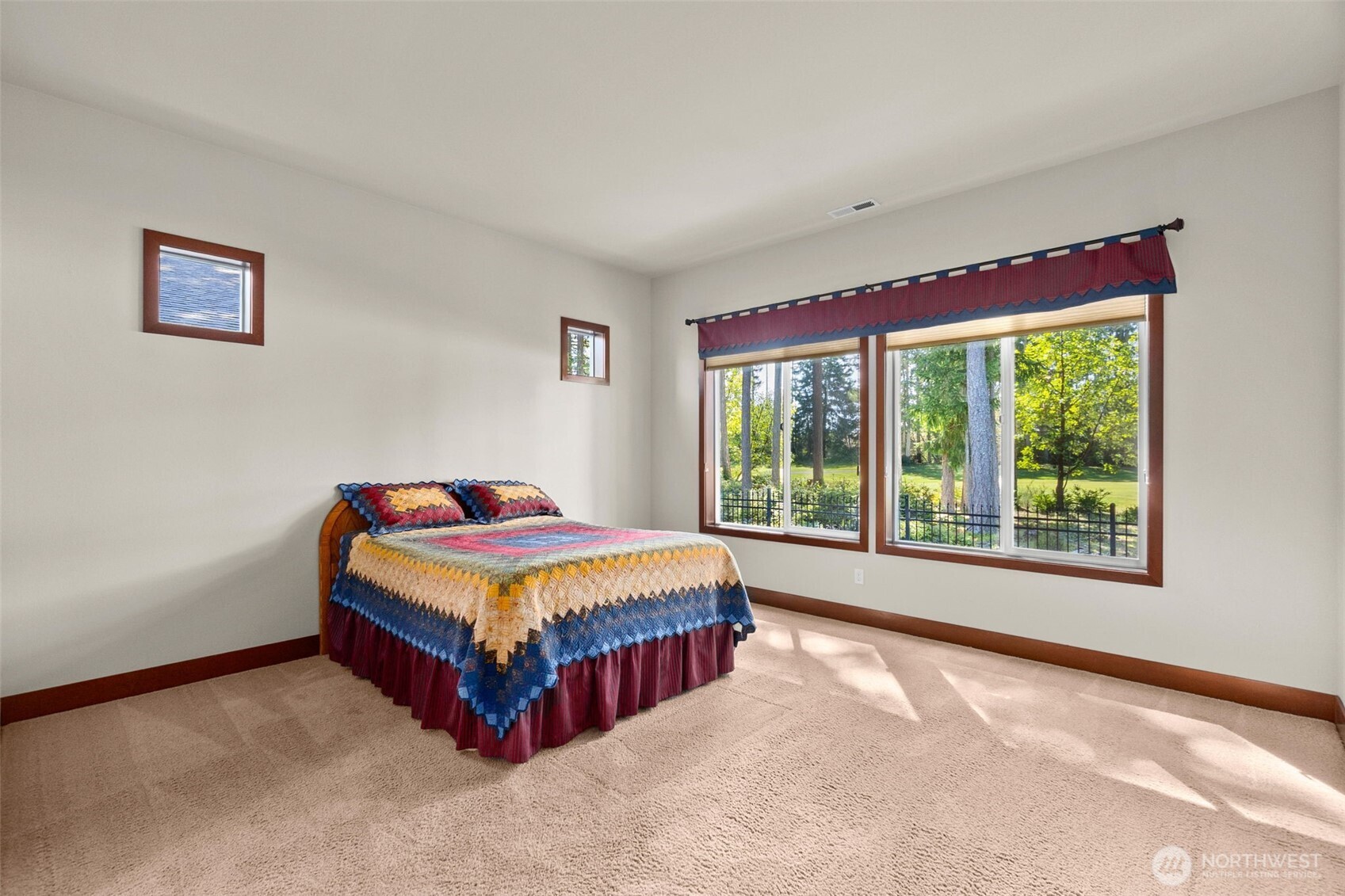 8235 Orcas Loop Northeast Olympia, WA 98516 - Photo 25 of 39 a bedroom with a bed and a window