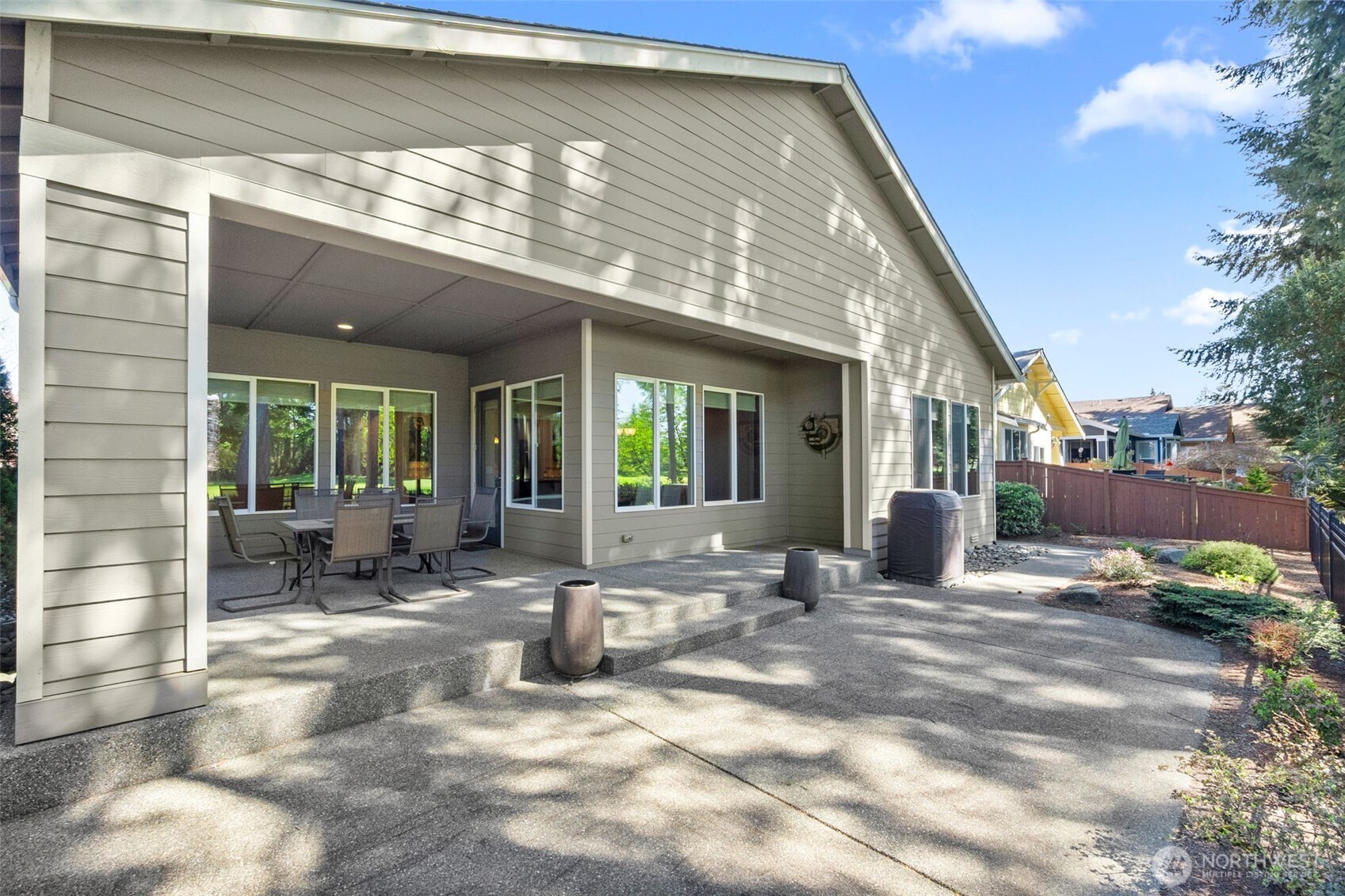 8235 Orcas Loop Northeast Olympia, WA 98516 - Photo 35 of 39 a view of a house with backyard sitting area and porch