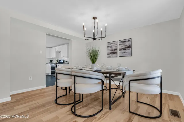 a view of a workspace with furniture and a ceiling fan