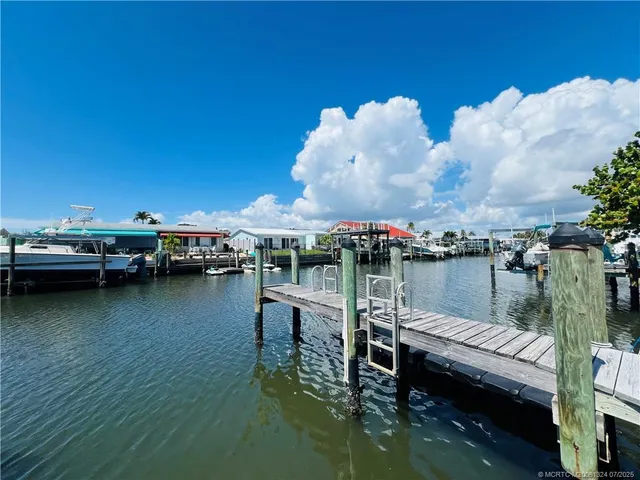 a view of a lake with boats and a roof deck