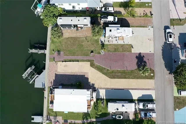 an aerial view of residential houses and outdoor space