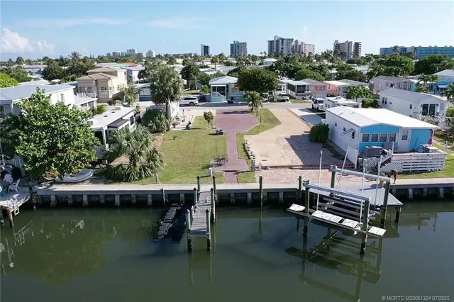 a view of a swimming pool with outdoor seating