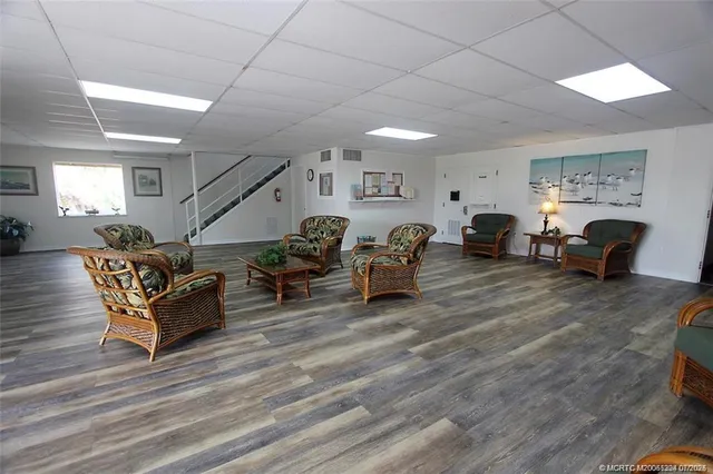 a room with wooden floor and balcony
