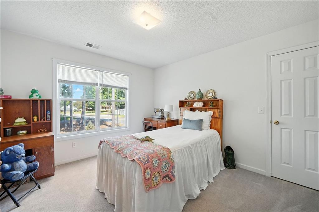 2000 Spicers Lane Woodstock, GA 30189 - Photo 19 of 33 a bedroom with a bed and a window