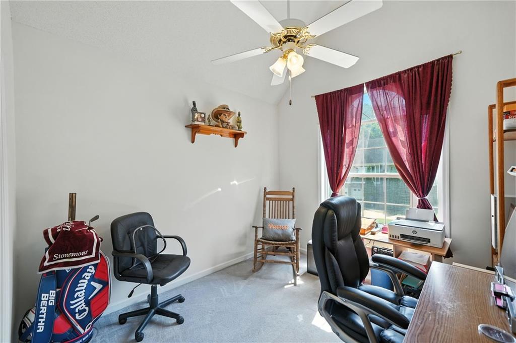 2000 Spicers Lane Woodstock, GA 30189 - Photo 22 of 33 a view of a workspace with furniture and a window