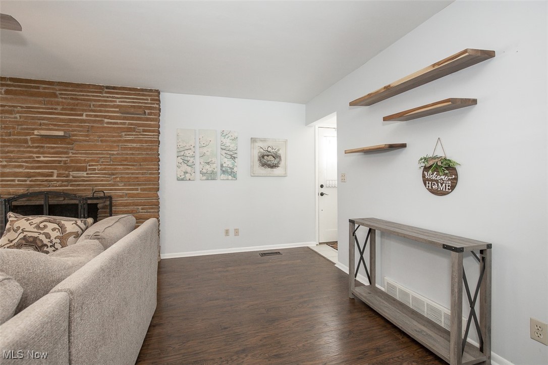 15446 Drake Road Strongsville, OH 44136 - Photo 19 of 42 Hallway with baseboards and dark wood-style flooring