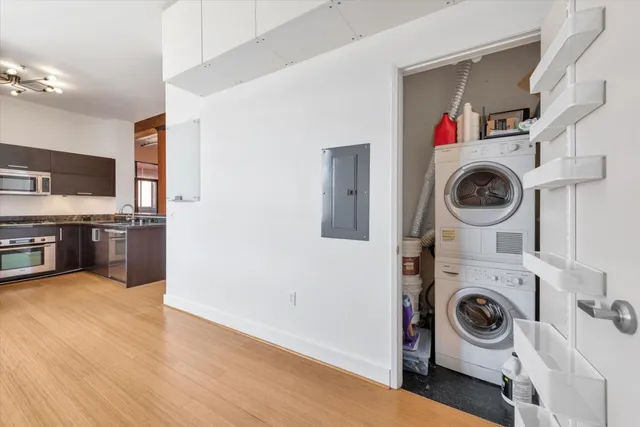 a view of kitchen and washer and dryer in a utility room