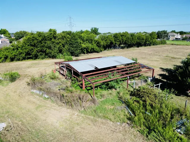 a view of a backyard of a house