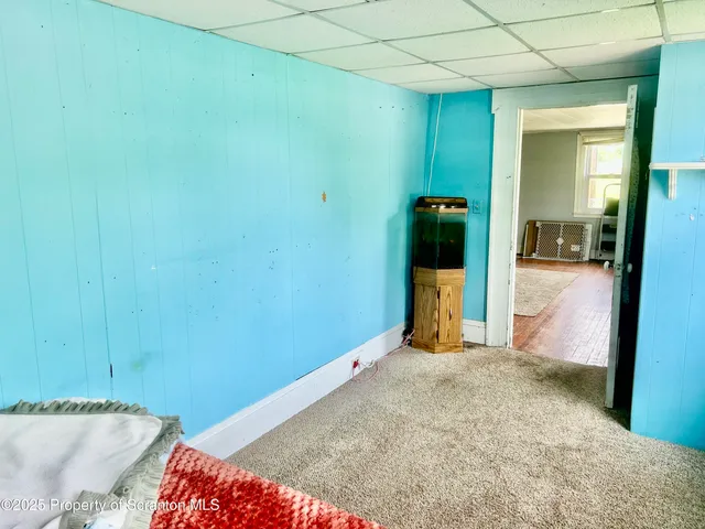 a view of walk in closet with clothes