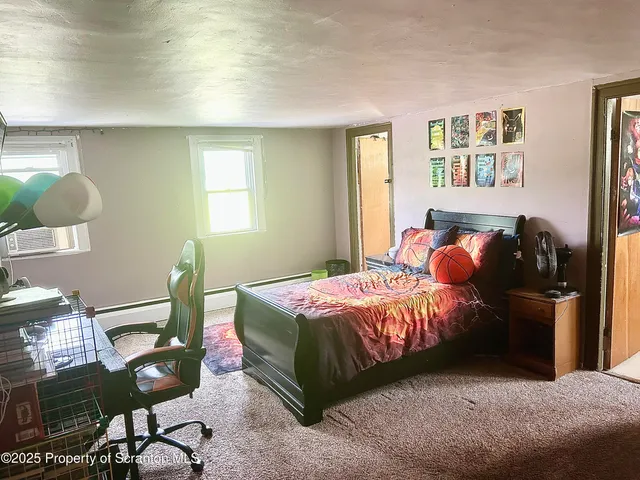 a view of a small room with closet