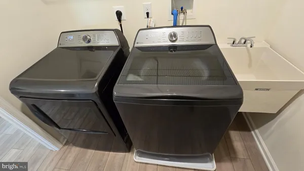 a utility room with washing machine