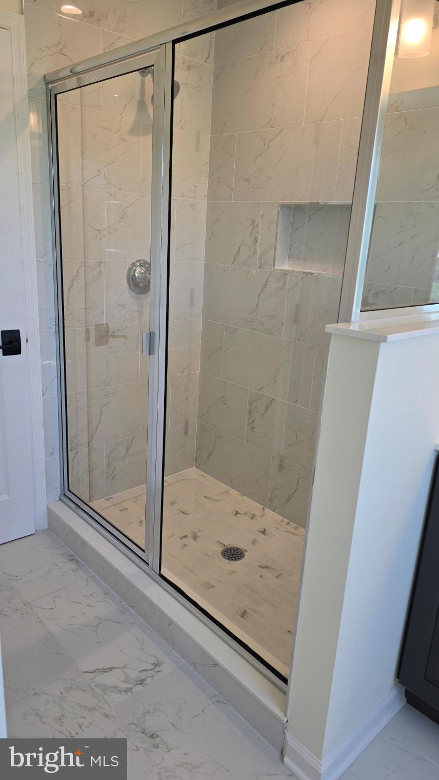 48 Parry Way Warminster, PA 18974 - Photo 3 of 23 Sleek modern shower with elegant marble tiles.