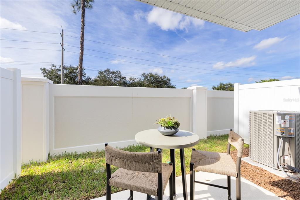 4443 Jetty Lane Palm Bay, FL 32905 - Photo 31 of 32 a view of a chairs and table in a patio