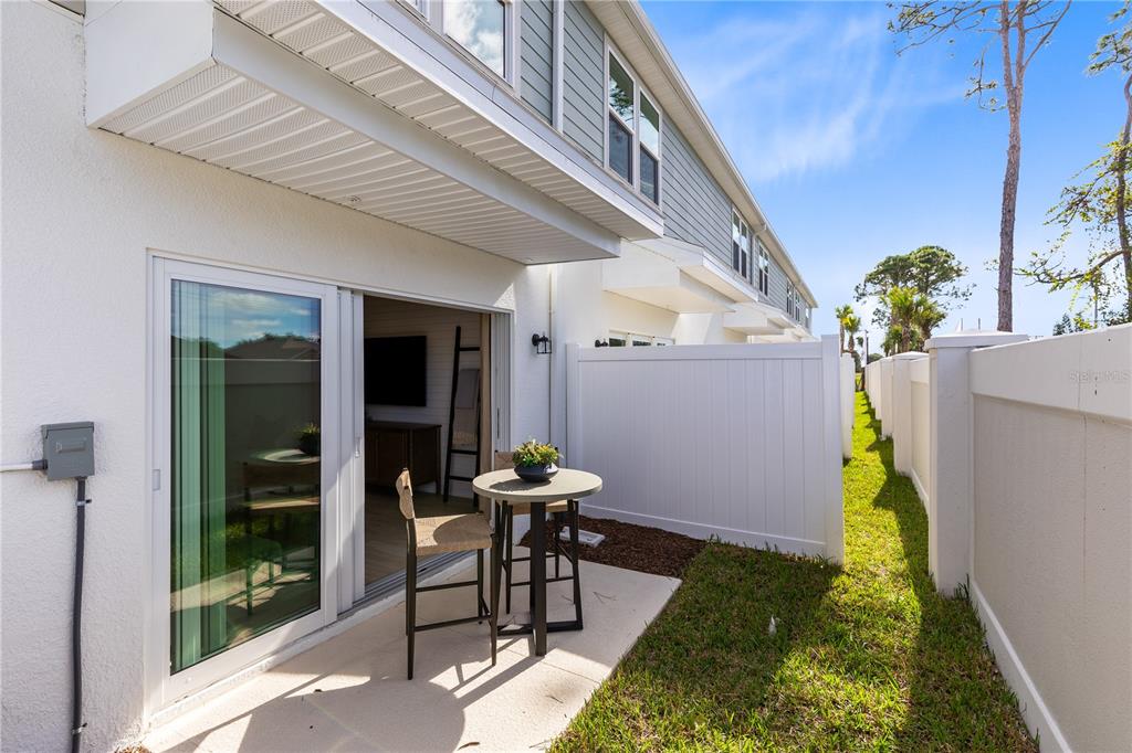 4443 Jetty Lane Palm Bay, FL 32905 - Photo 32 of 32 a balcony with table and chairs