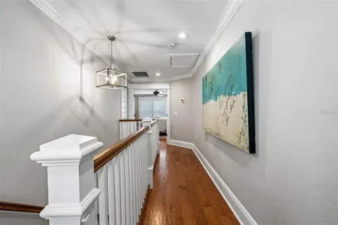 a bed room with a bed and a ceiling fan