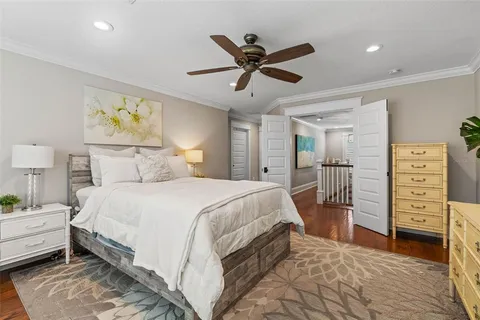 a bedroom with a bed and a chandelier