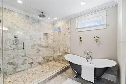a spacious bathroom with a sink a mirror and a shower