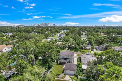 an aerial view of a house with outdoor space and street view