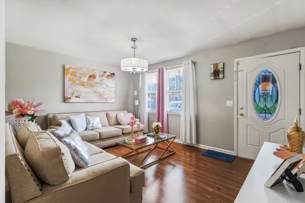a living room with furniture and a window