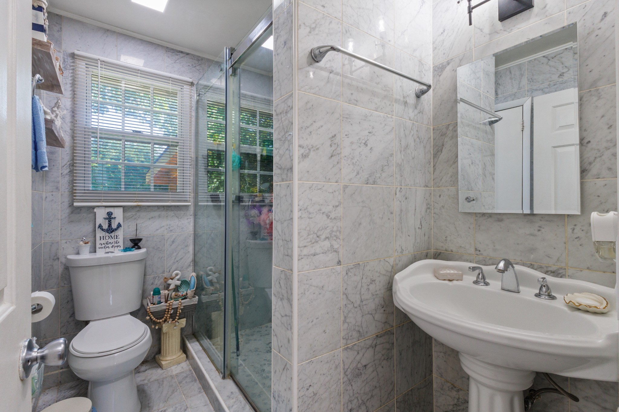 528 Singer Drive Madison, TN 37115 - Photo 9 of 24 a bathroom with a sink toilet and shower