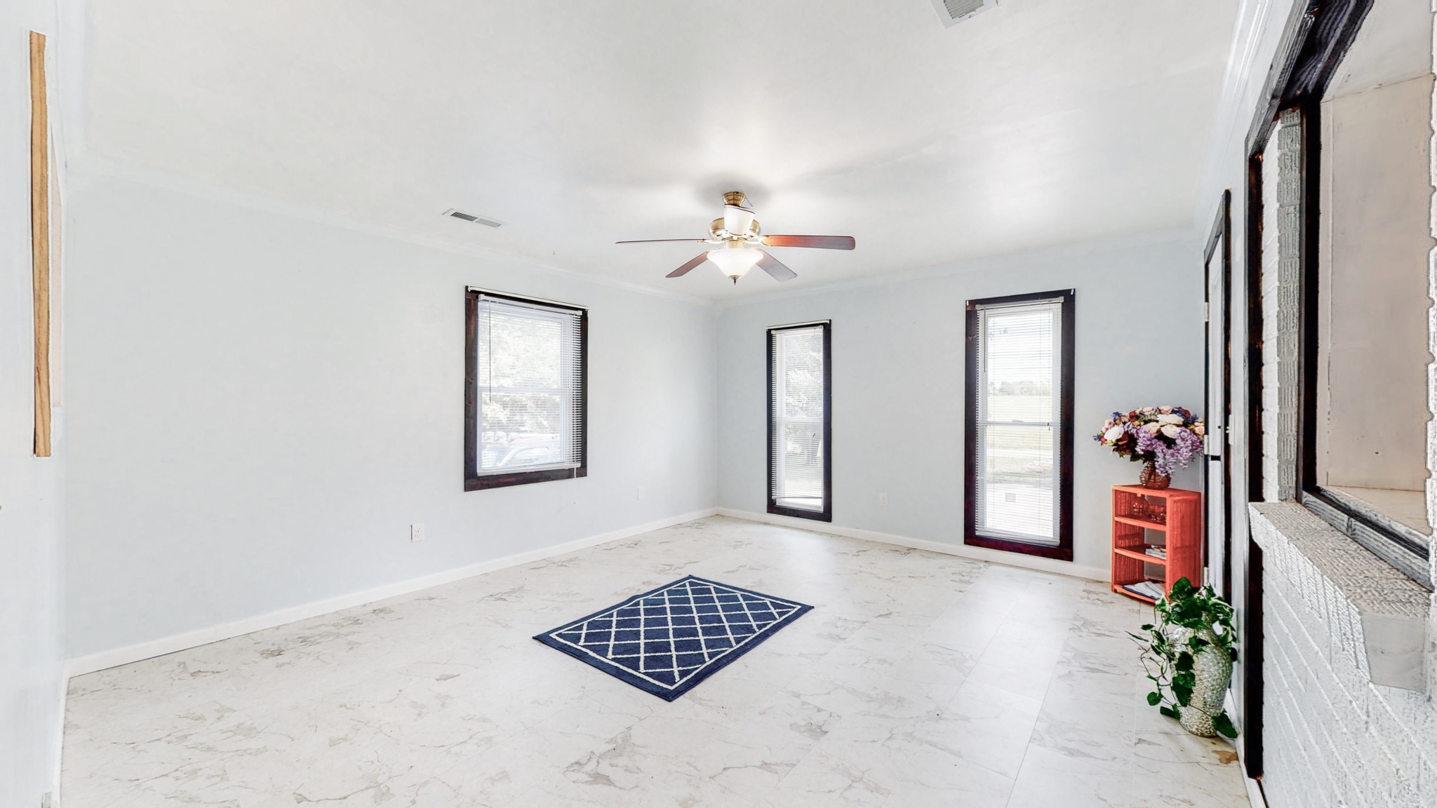 31129 Ardmore Ridge Road Ardmore, TN 38449 - Photo 15 of 50 an empty room with windows and ceiling fan