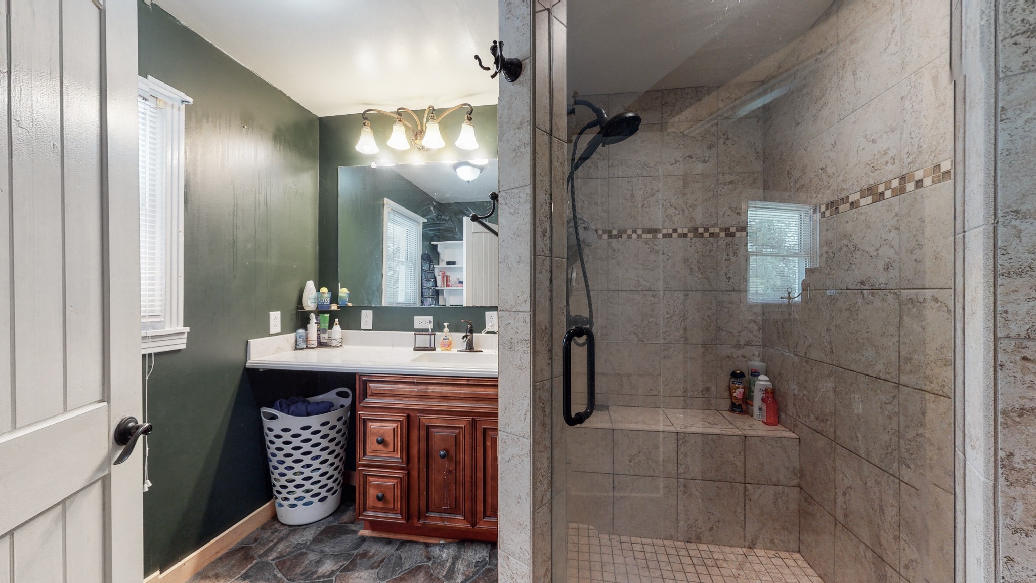 31129 Ardmore Ridge Road Ardmore, TN 38449 - Photo 27 of 50 a bathroom with a sink a toilet a mirror and shower