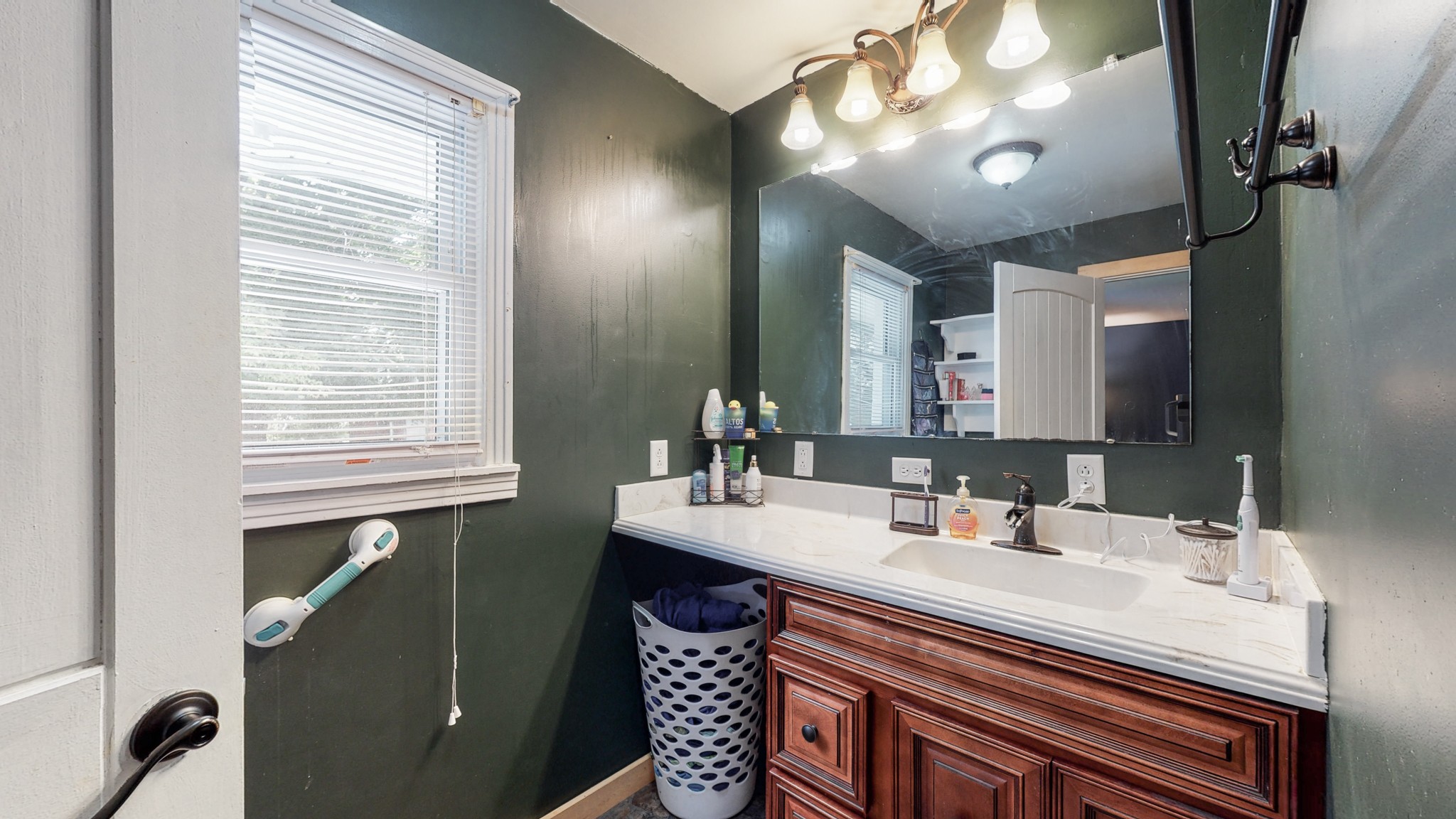 31129 Ardmore Ridge Road Ardmore, TN 38449 - Photo 28 of 50 a bathroom with a sink vanity and a mirror