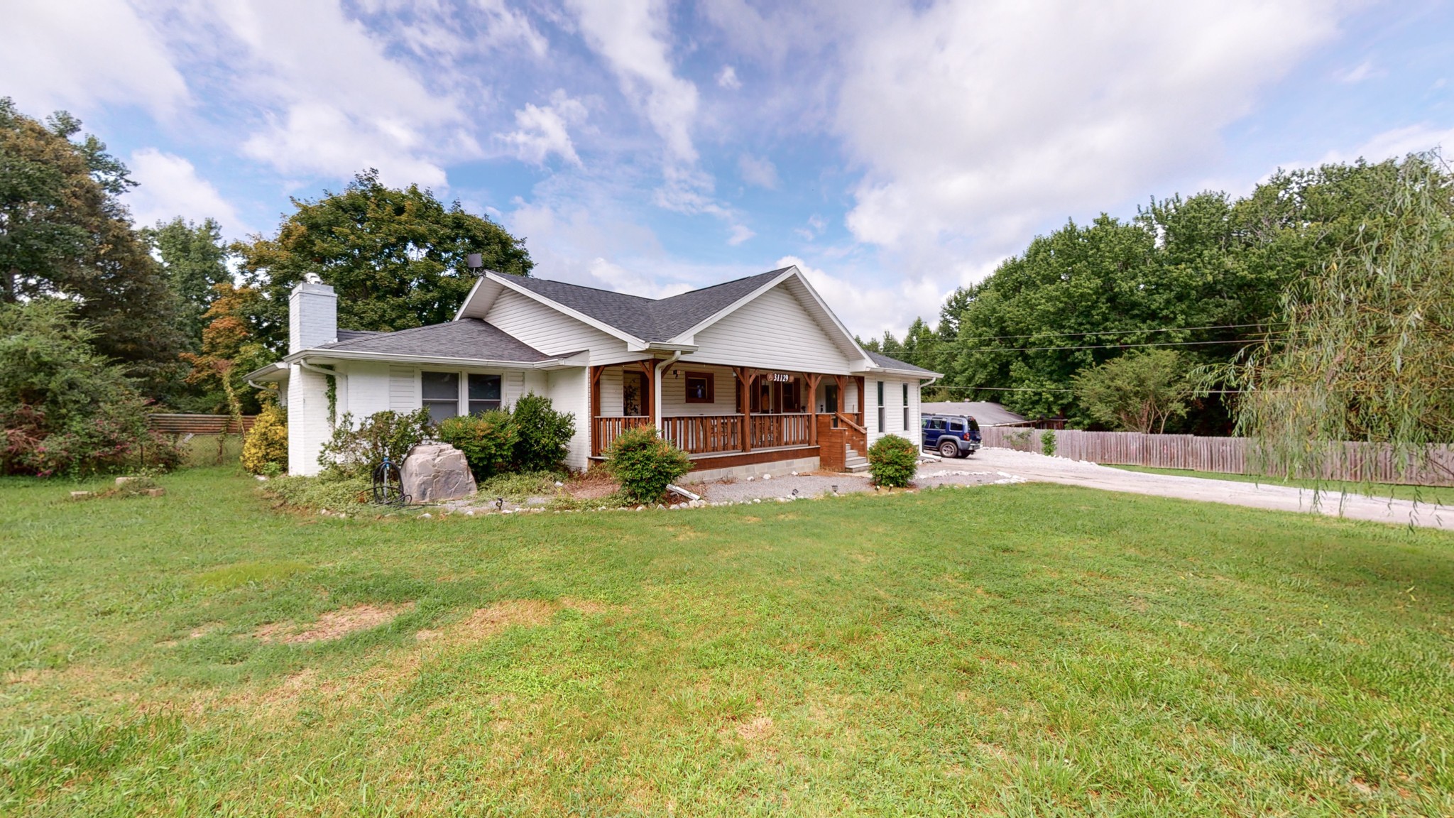 31129 Ardmore Ridge Road Ardmore, TN 38449 - Photo 3 of 50 a front view of a house with garden