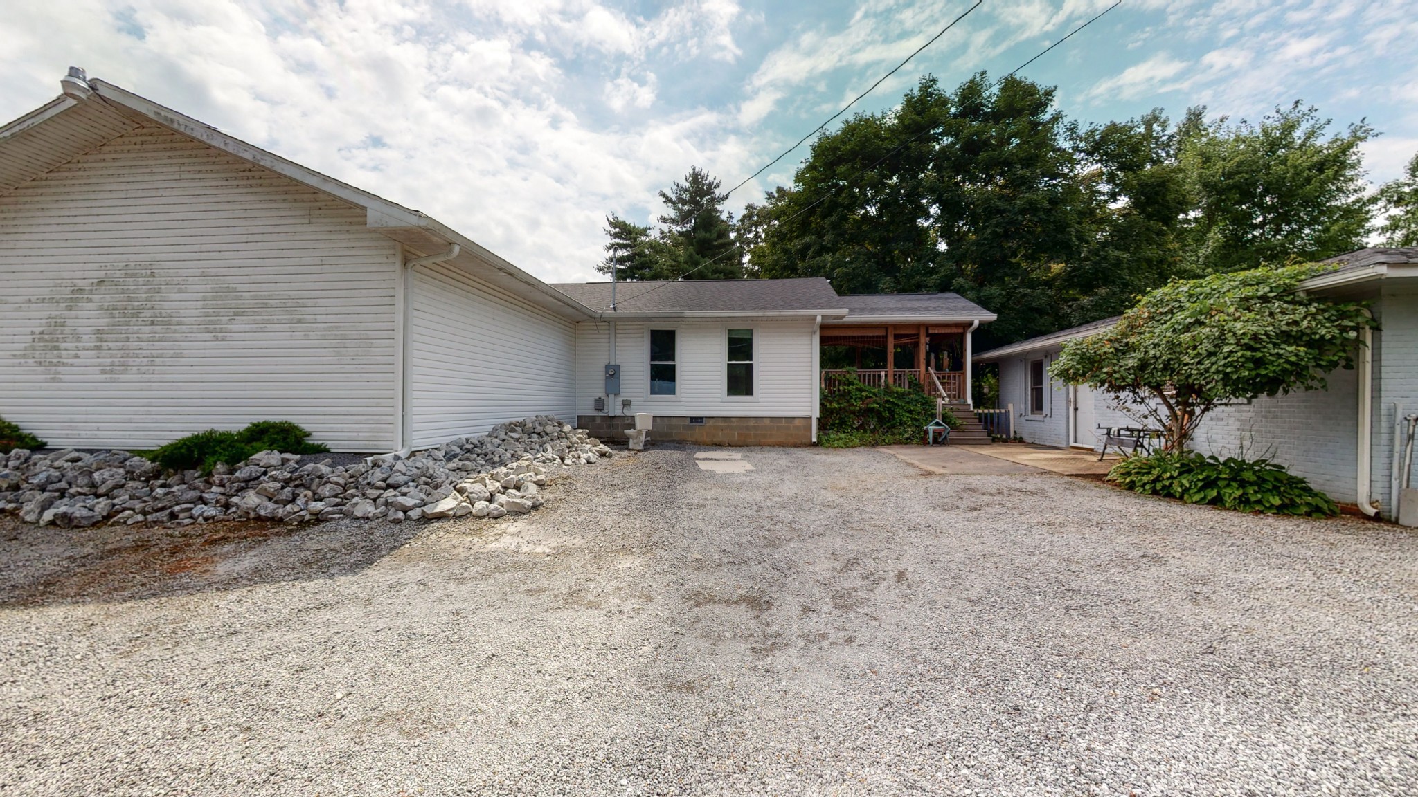 31129 Ardmore Ridge Road Ardmore, TN 38449 - Photo 38 of 50 a view of a house with a yard and potted plants