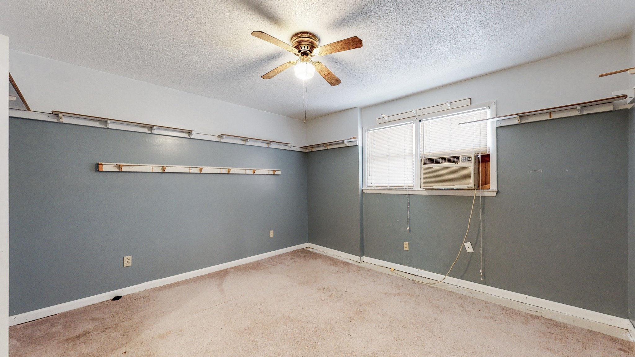31129 Ardmore Ridge Road Ardmore, TN 38449 - Photo 43 of 50 a view of a big room with wooden floor and a ceiling fan