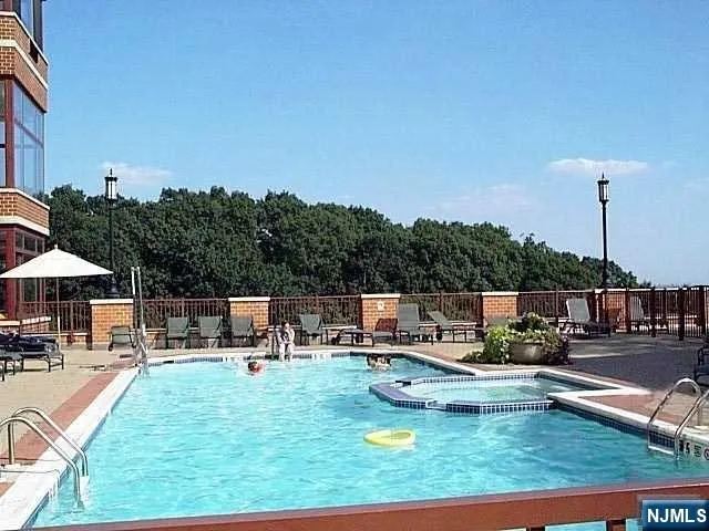 a view of a swimming pool with a patio