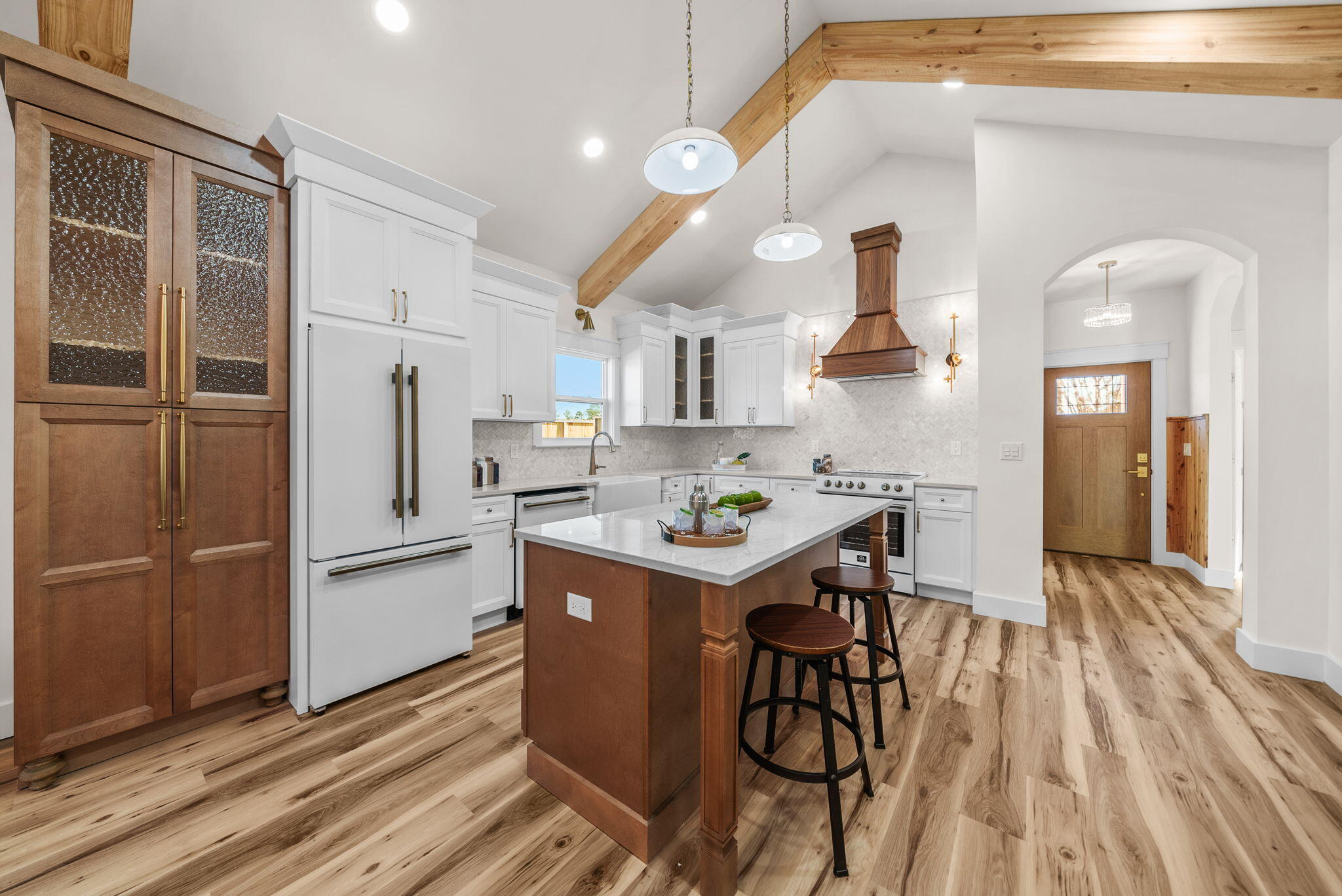 1831 McKenzie Road Southport, FL 32409 - Photo 1 of 48 a kitchen with stainless steel appliances granite countertop a refrigerator a sink dishwasher a stove and white countertops with wooden floor
